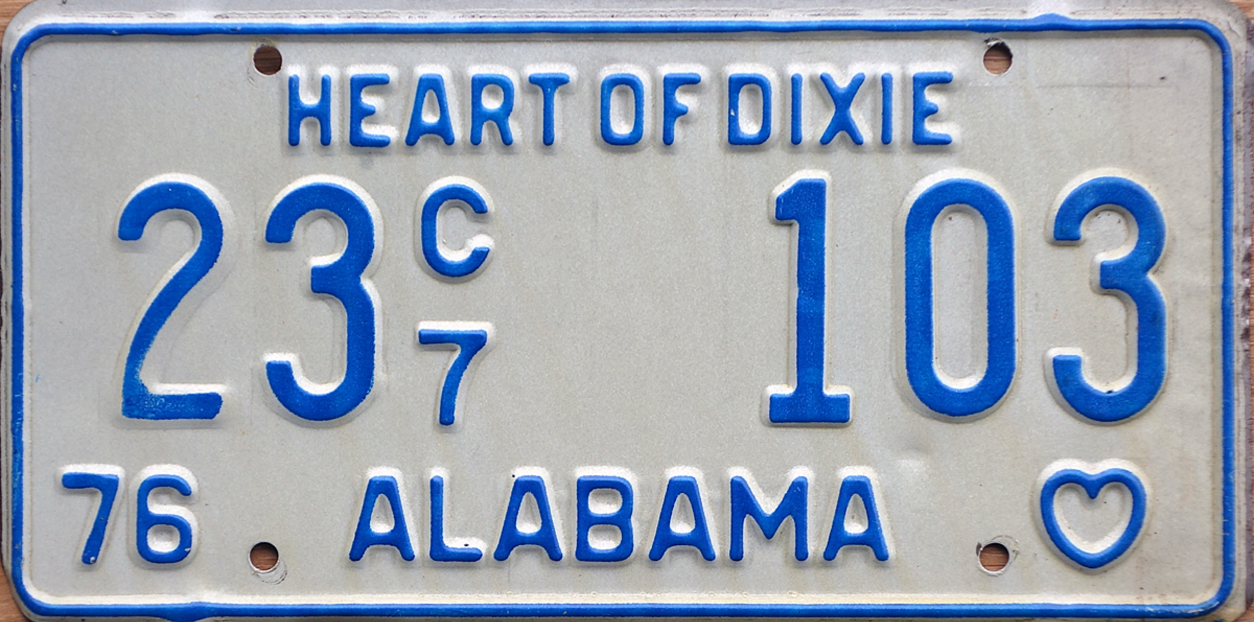 A 1976 Alabama license plate with the number 23 C7 103
